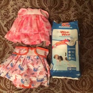 Bundle of 11 pack of Medium doggy diapers and 2 ruffle dog covers.